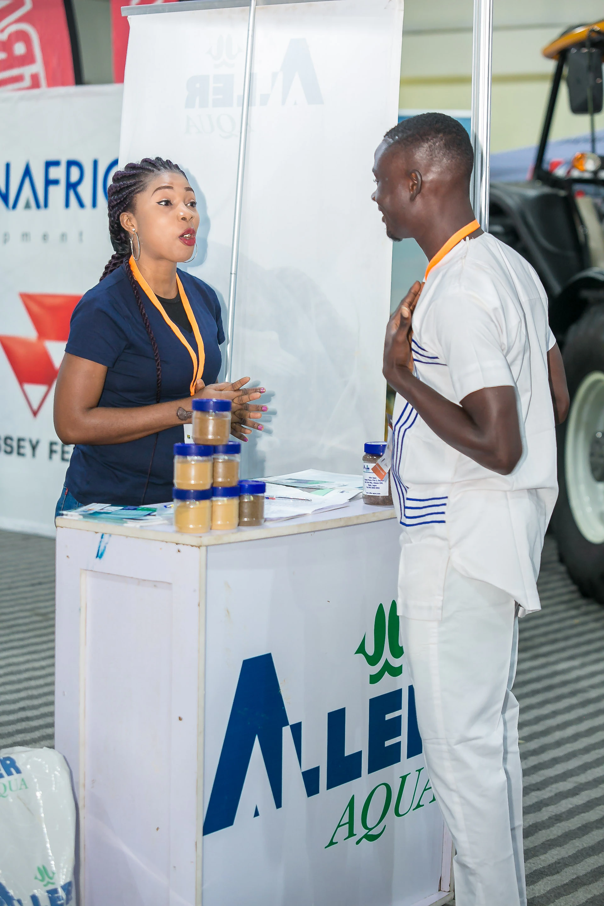 Exhibitor presenting agricultural products and innovations to visitors at Growtech West Africa in Lagos.