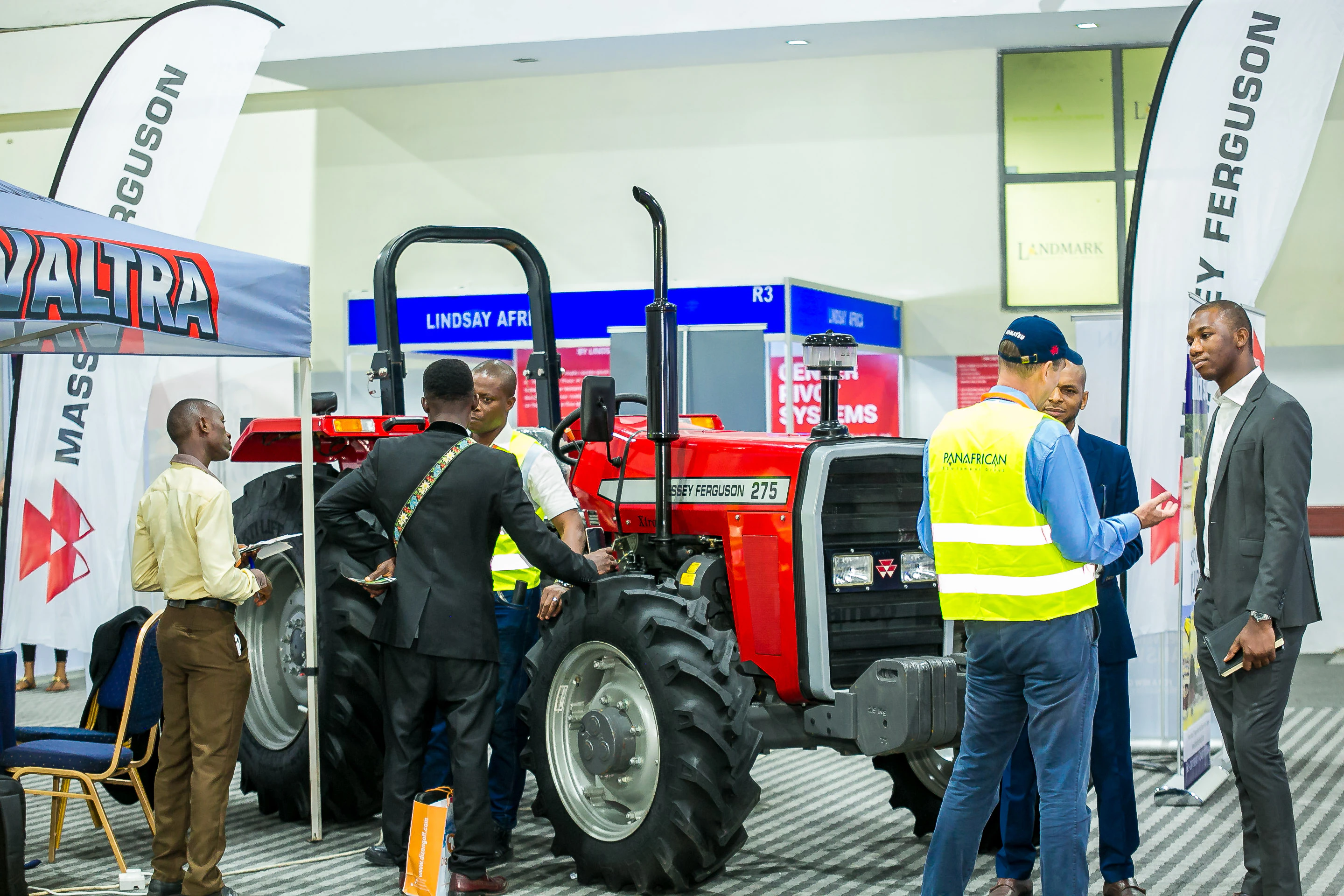 Visitors exploring modern agricultural machinery and farm equipment at Growtech West Africa agriculture exhibition.