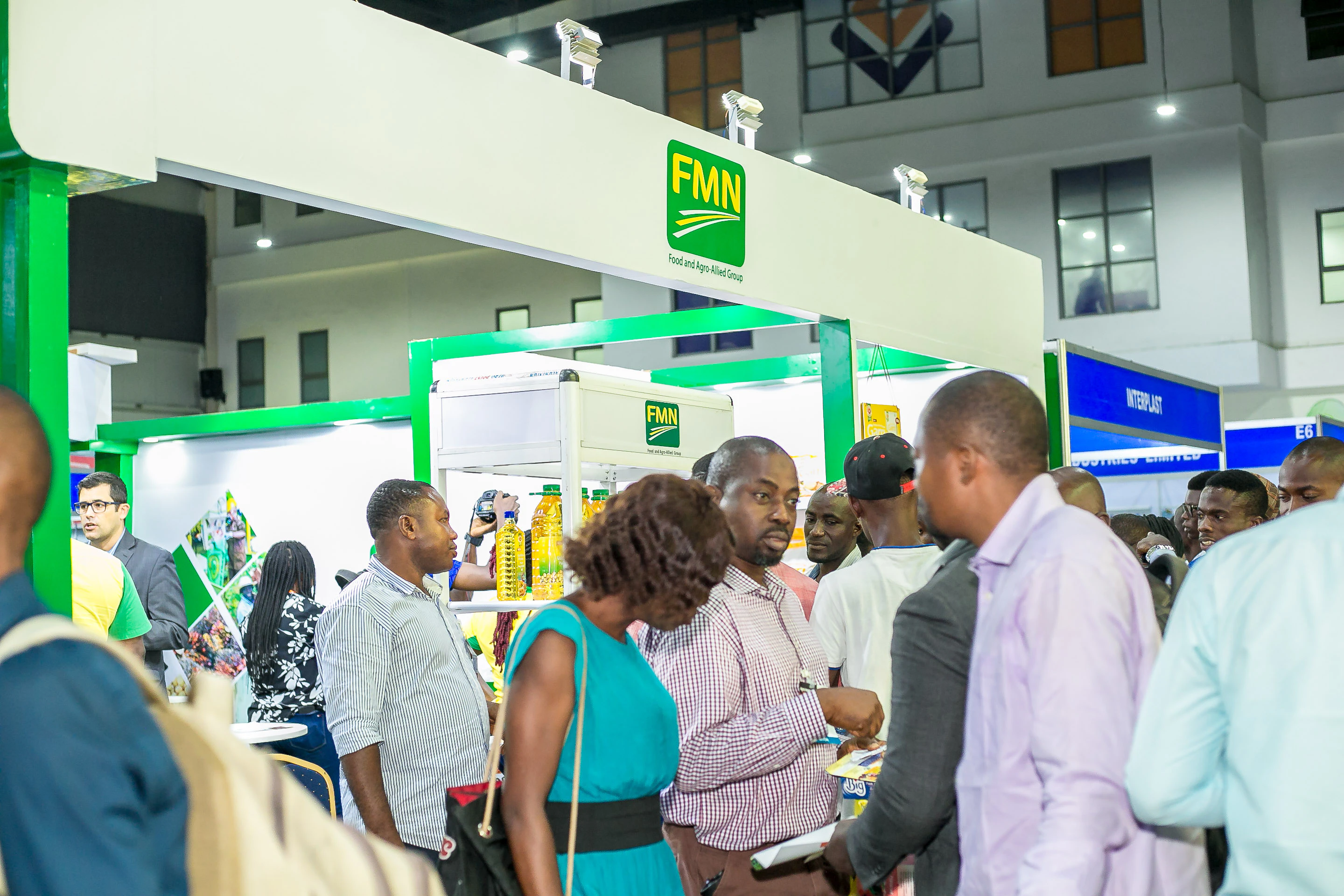 Agribusiness professionals networking and discovering agricultural innovations at Growtech West Africa exhibition.