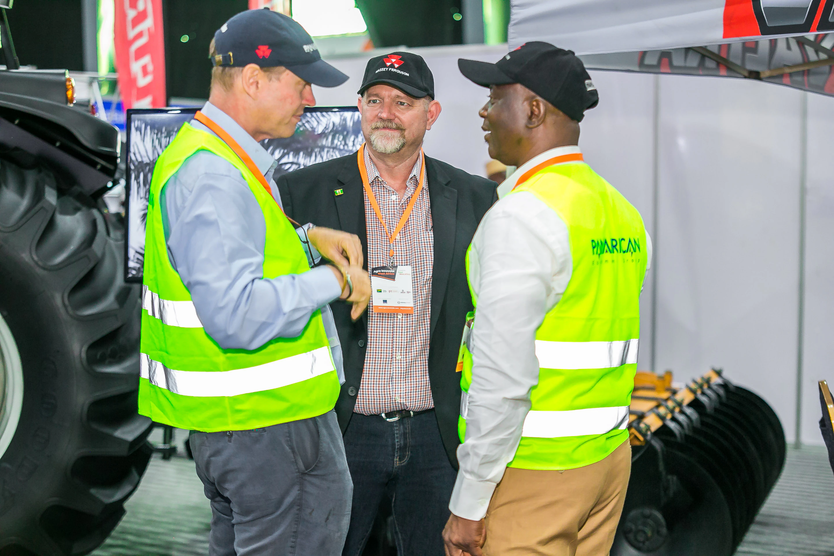 International agriculture professionals discussing agribusiness opportunities at Growtech West Africa in Lagos.