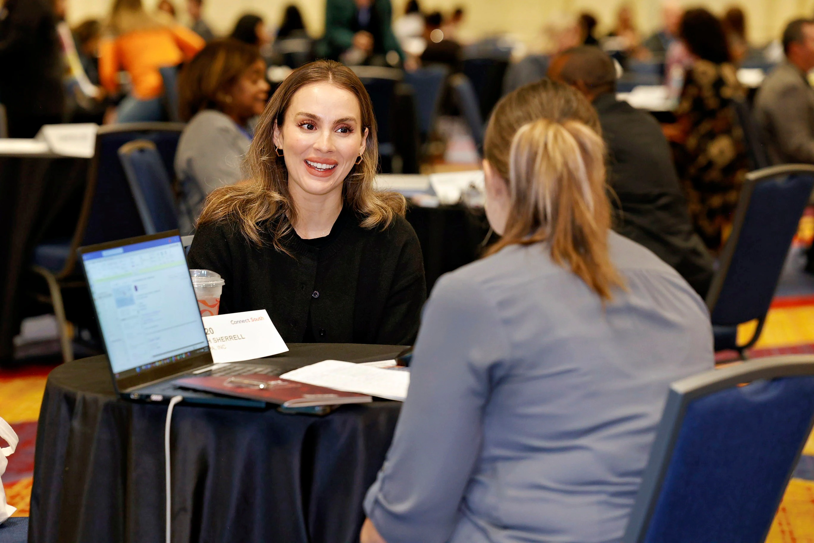 A woman and a man meeting during one-on-one appointments at Connect North.