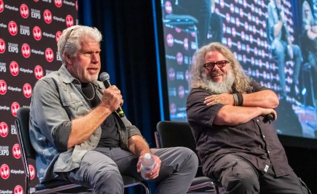 Ron Perlman and a costar sit on stage talking