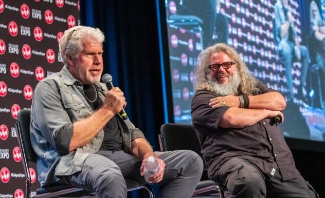 Ron Perlman and a costar sit on stage talking