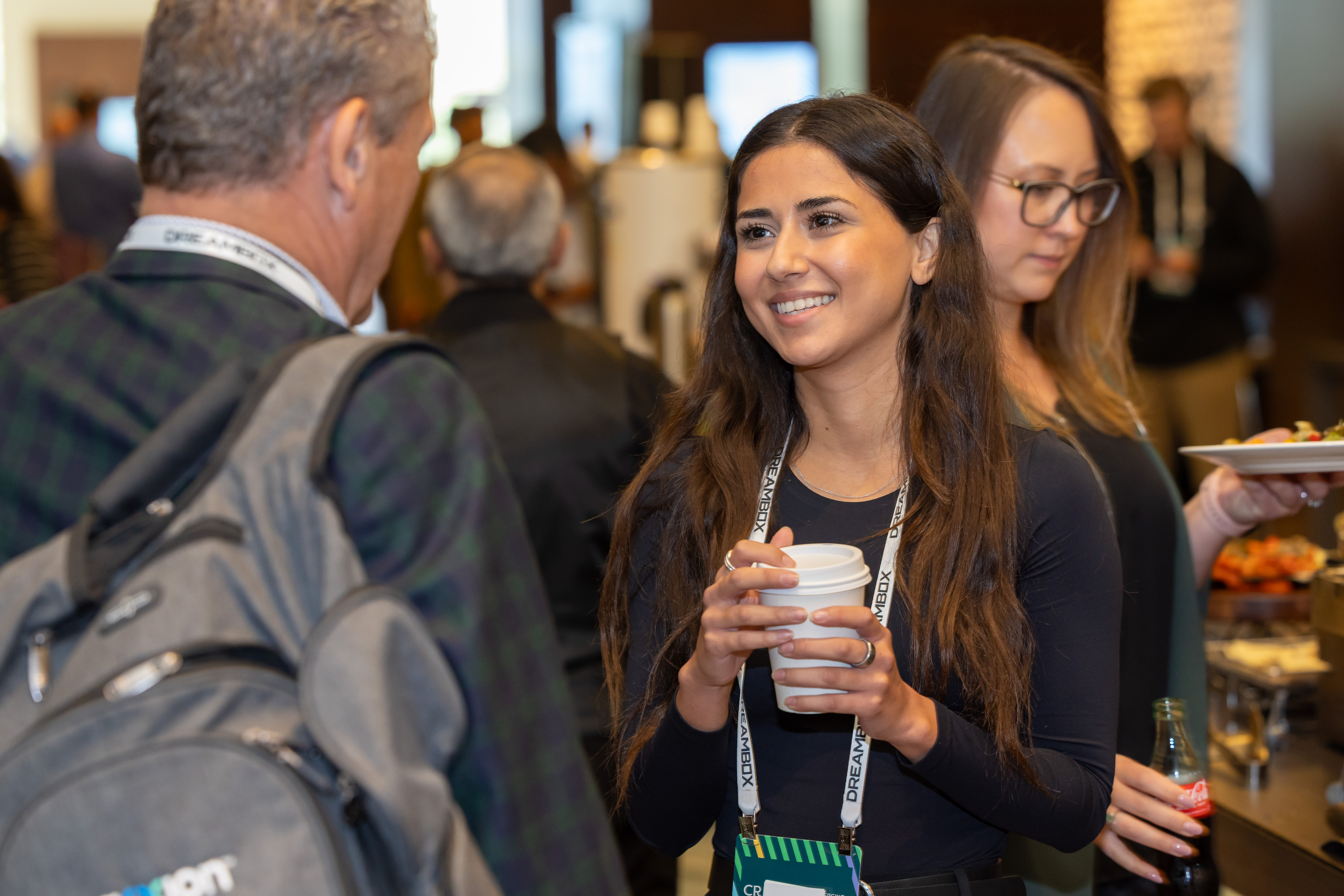 Image of attendees and sponsors speaking at CREATE 2025