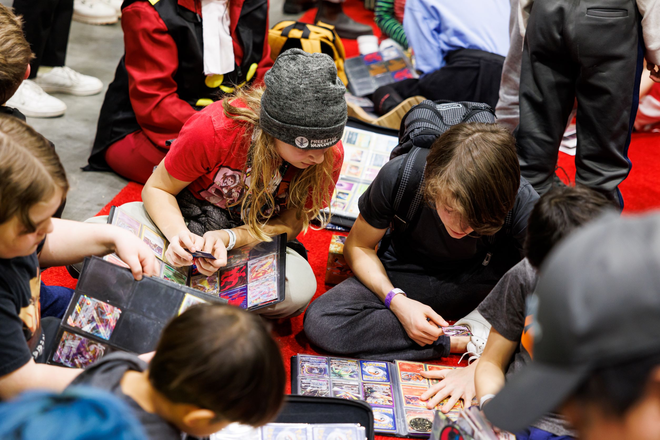 Kids trading Pokémon cards at the Pokémon Trade Meetup