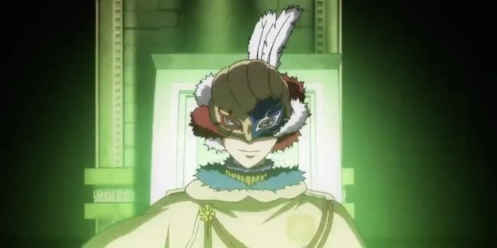 person wearing strange feathered mask standing in a dark underground room