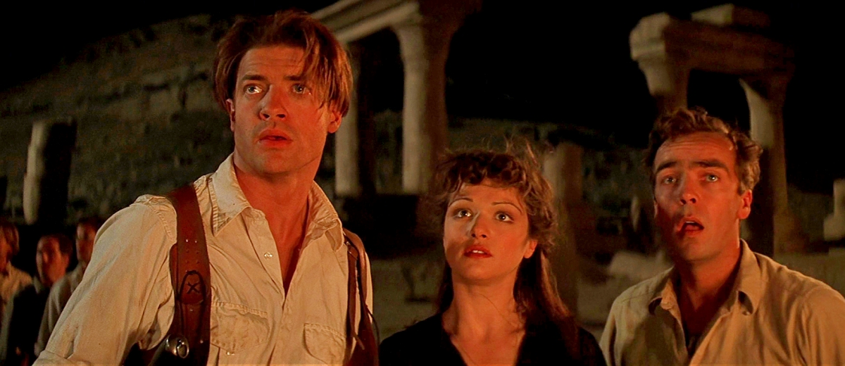 Three of the protagonists from The Mummy (1999). From left to right: Rick O'Connell (Brendan Fraser), Evelyn Carnahan (Rachel Weisz), and Jonathan Carnahan (John Hannah).