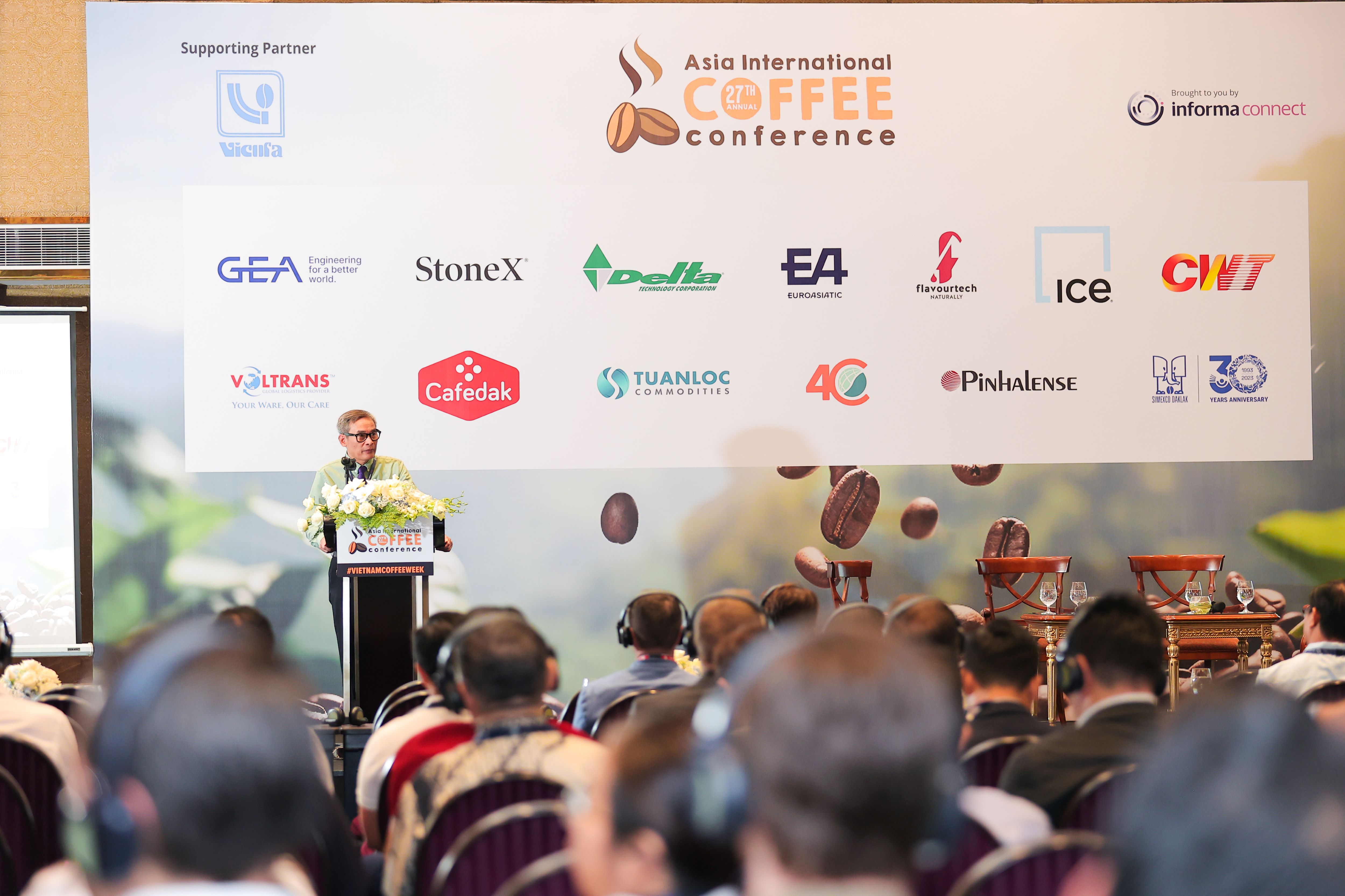 booth representatives at asia international coffee conference