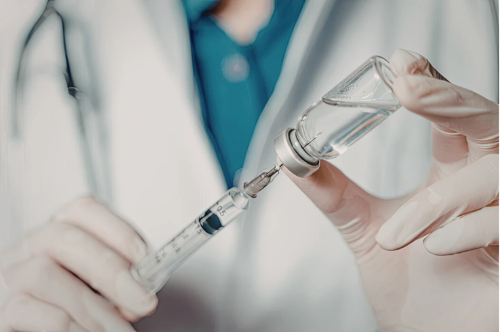 Veterinary professional preparing a vaccine for animal health and livestock disease prevention