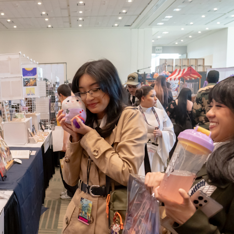 Fans Shopping with one holding a cute plushy