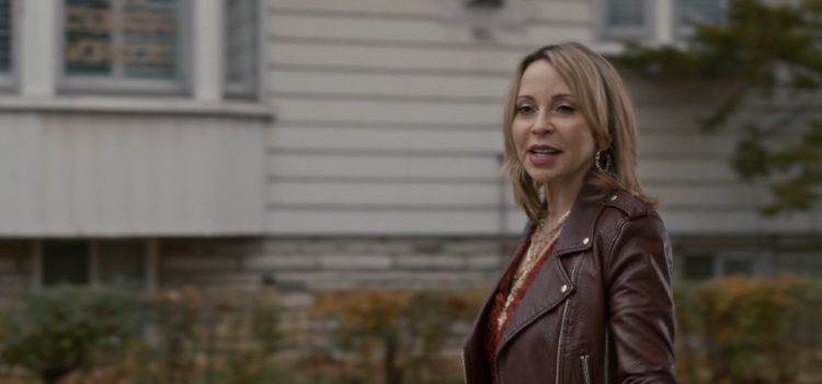 woman in leather jacket looking tough