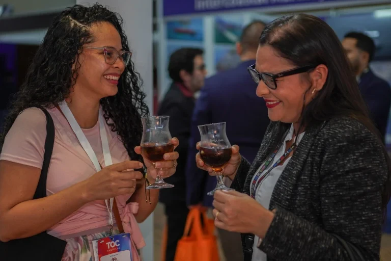 Attendees networking during the event reception.