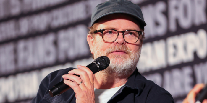 Rainn Wilson listens attentively to the moderator as they ask their next question during his panel at FAN EXPO Portland.
