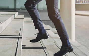 a photo of a men’s running the up the stairs