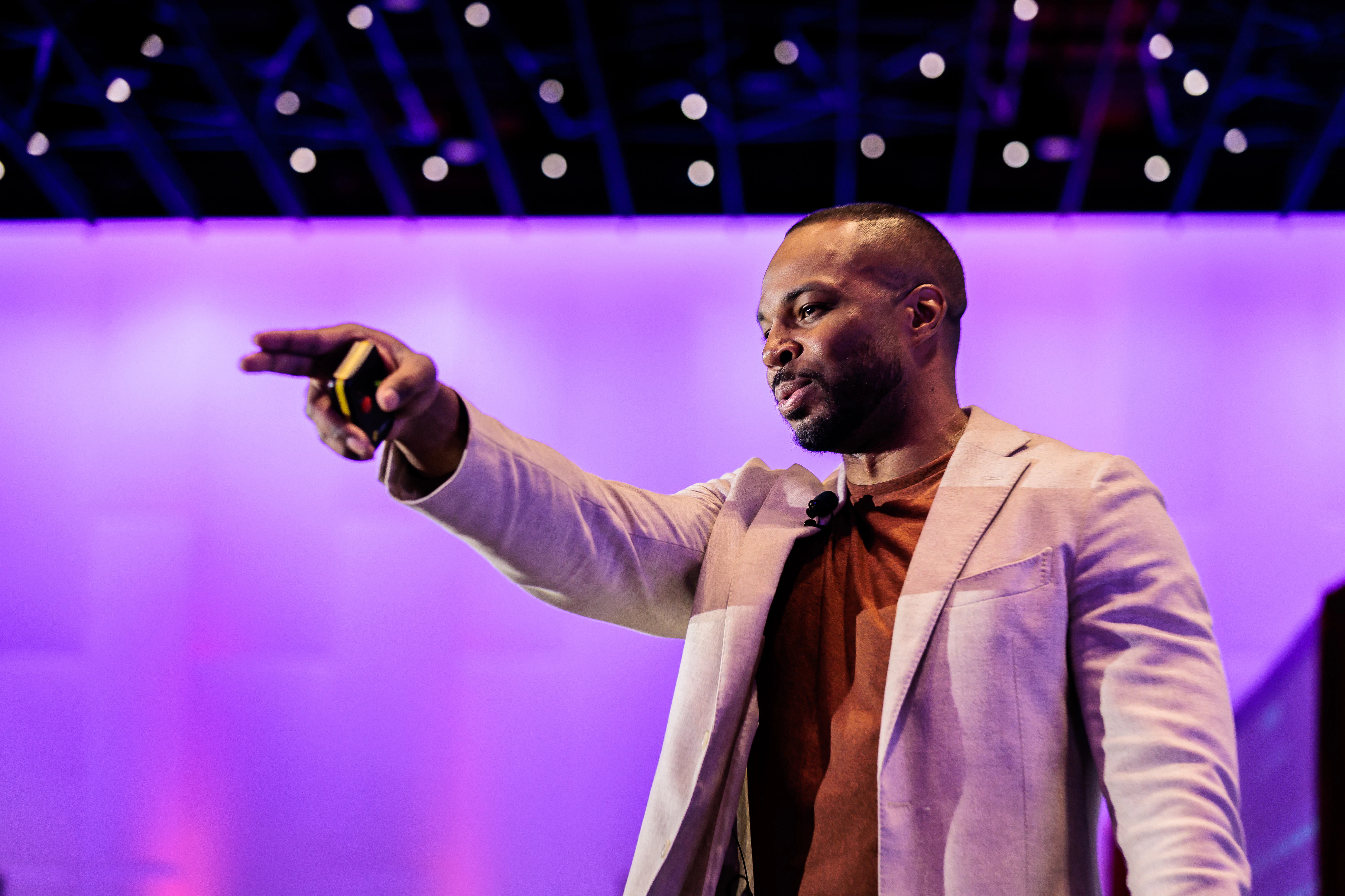 Speaker on stage at eToursim Summit leading a session.