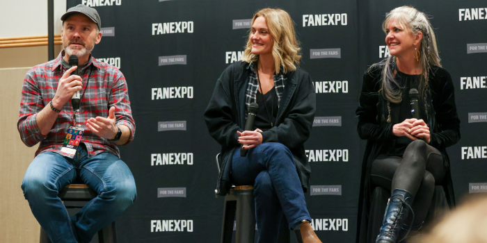 ROGER CRAIG SMITH, PATRICIA SUMMERSETT, AND JENNIFER HALE ARE SEATED TOGETHER ON STOOLS FOR THEIR PANEL. PATRICIA (CENTER) AND JENNIFER (RIGHT) SMILE AS ROGER (LEFT) SHARES AN ANECDOTE