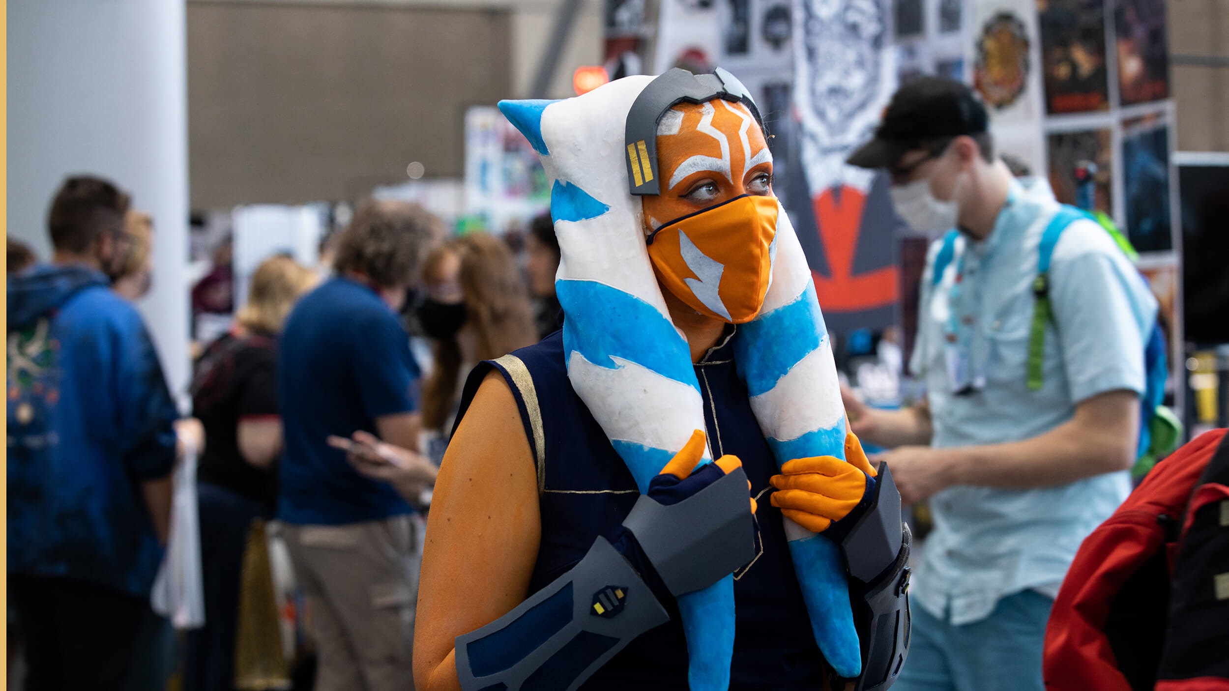 An Ahsoka Tano cosplayer looks off in the distance