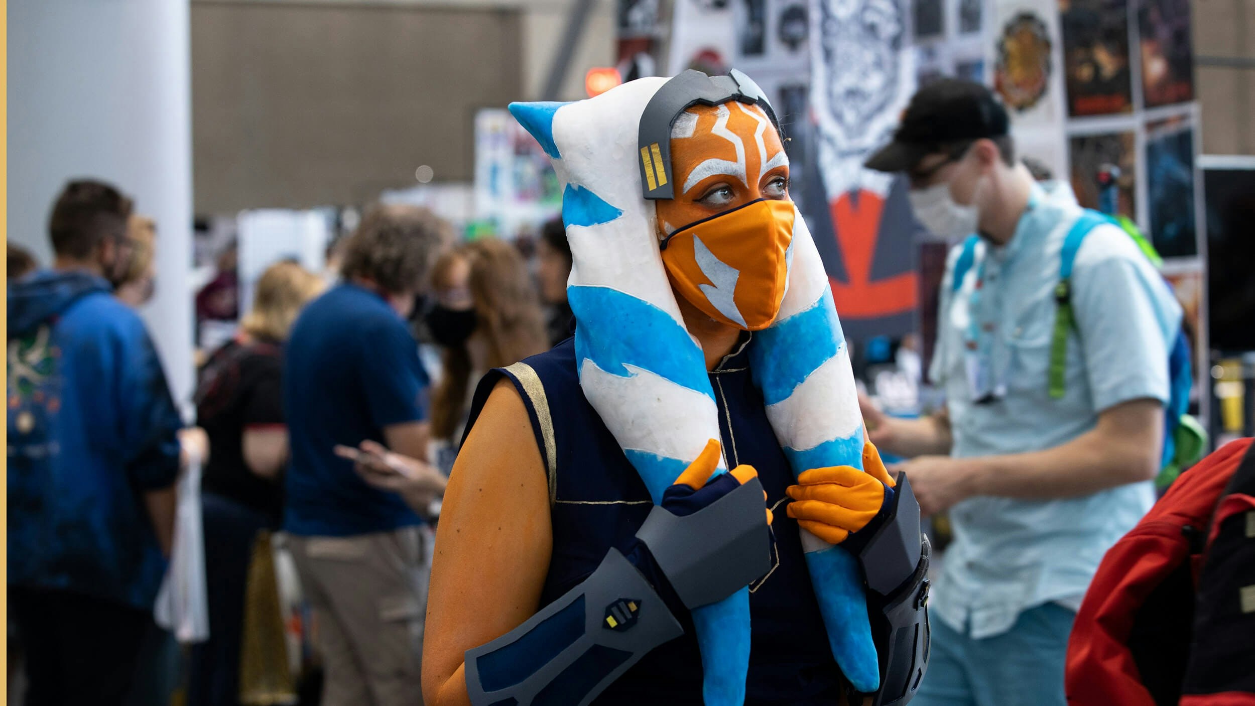 An Ahsoka Tano cosplayer looks off in the distance