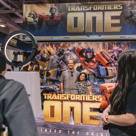Fans posed with the Transformers One photo op get their picture taken using the ring light and selfie station. 