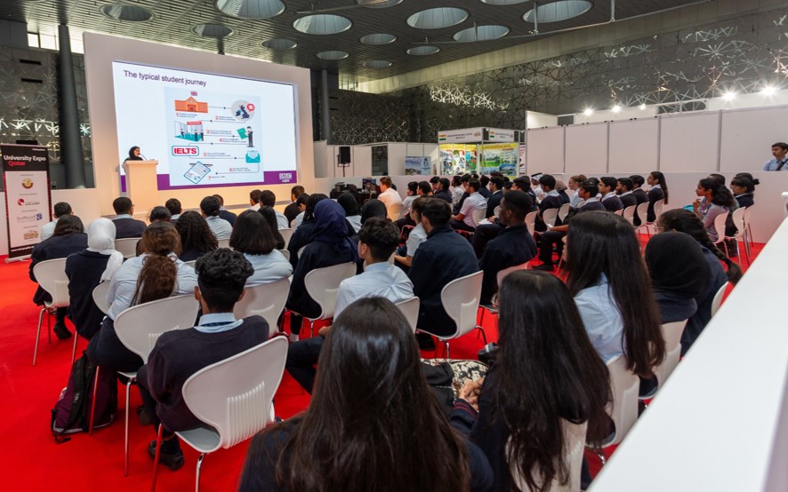 Large seminar session at Najah Doha, with students learning about admissions, scholarships, and international education.