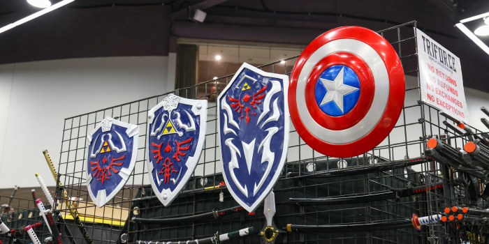 Picture depicts a display of shields for sale inspired by video game characters and super heroes