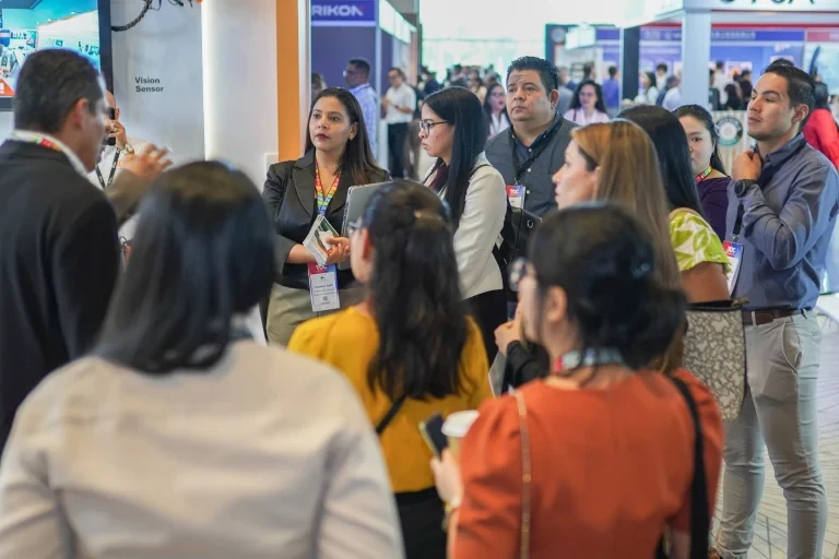 Attendees gathered around an exhibitor booth during the event.