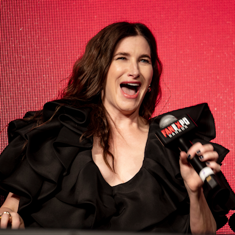 Kathryn Hahn smiles a wide-mouthed smile at the audience during the Agatha All Along promotional panel 