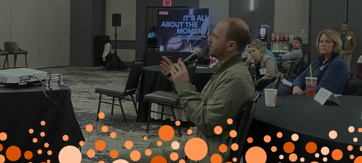 Man speaking during a general session at the previous dispensed beverage forum.