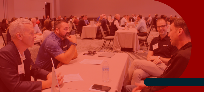 Photo of attendees mingling after a general session.