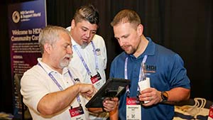 A diverse group of IT service and support professionals networking and exchanging strategies at the HDI conference to solve shared organizational challenges.