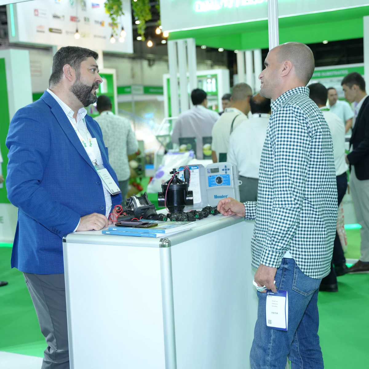 Agriculture technology exhibitor demonstrating innovative farming solutions to visitors at Growtech Middle East