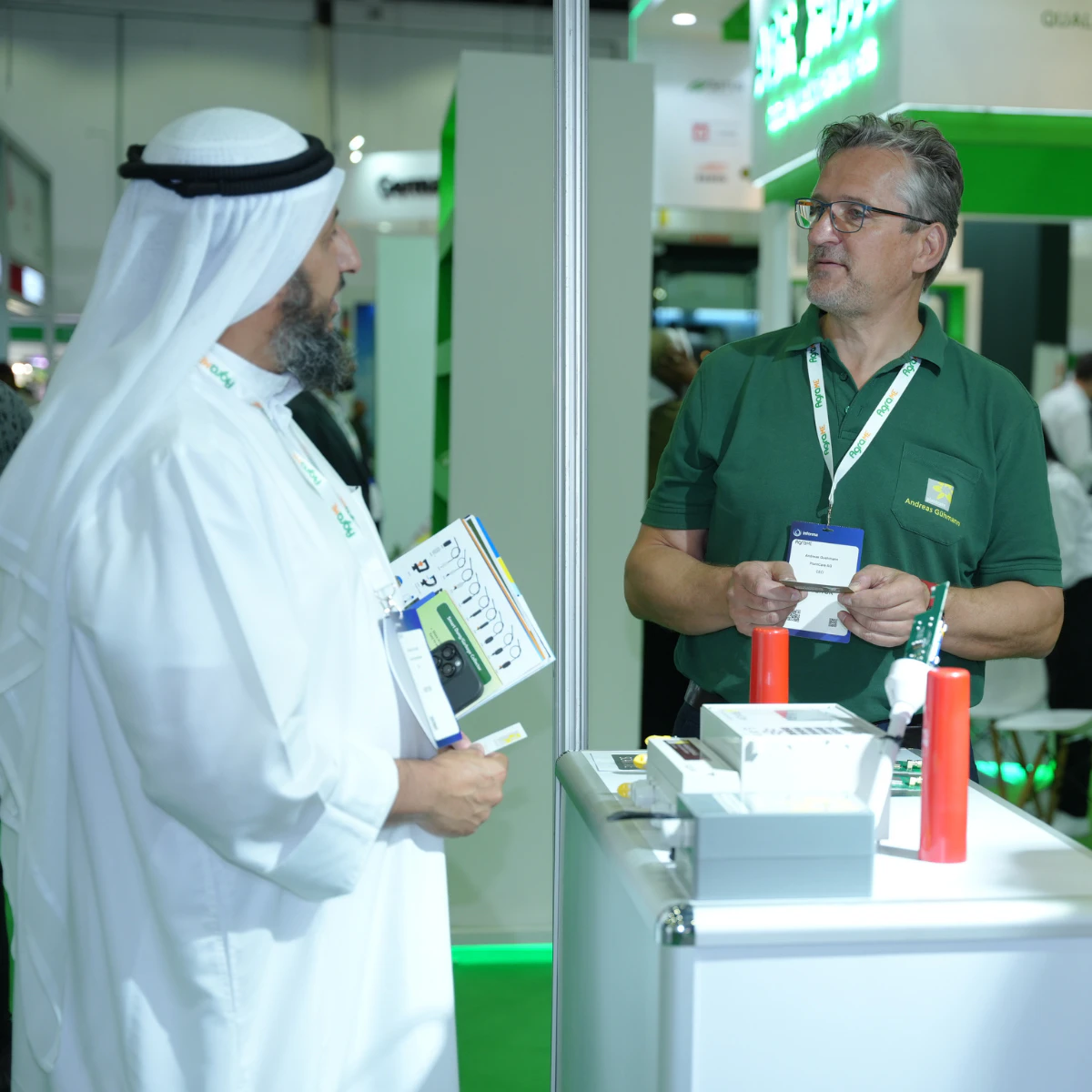 Agriculture professionals discussing innovative farming technologies at Growtech Middle East