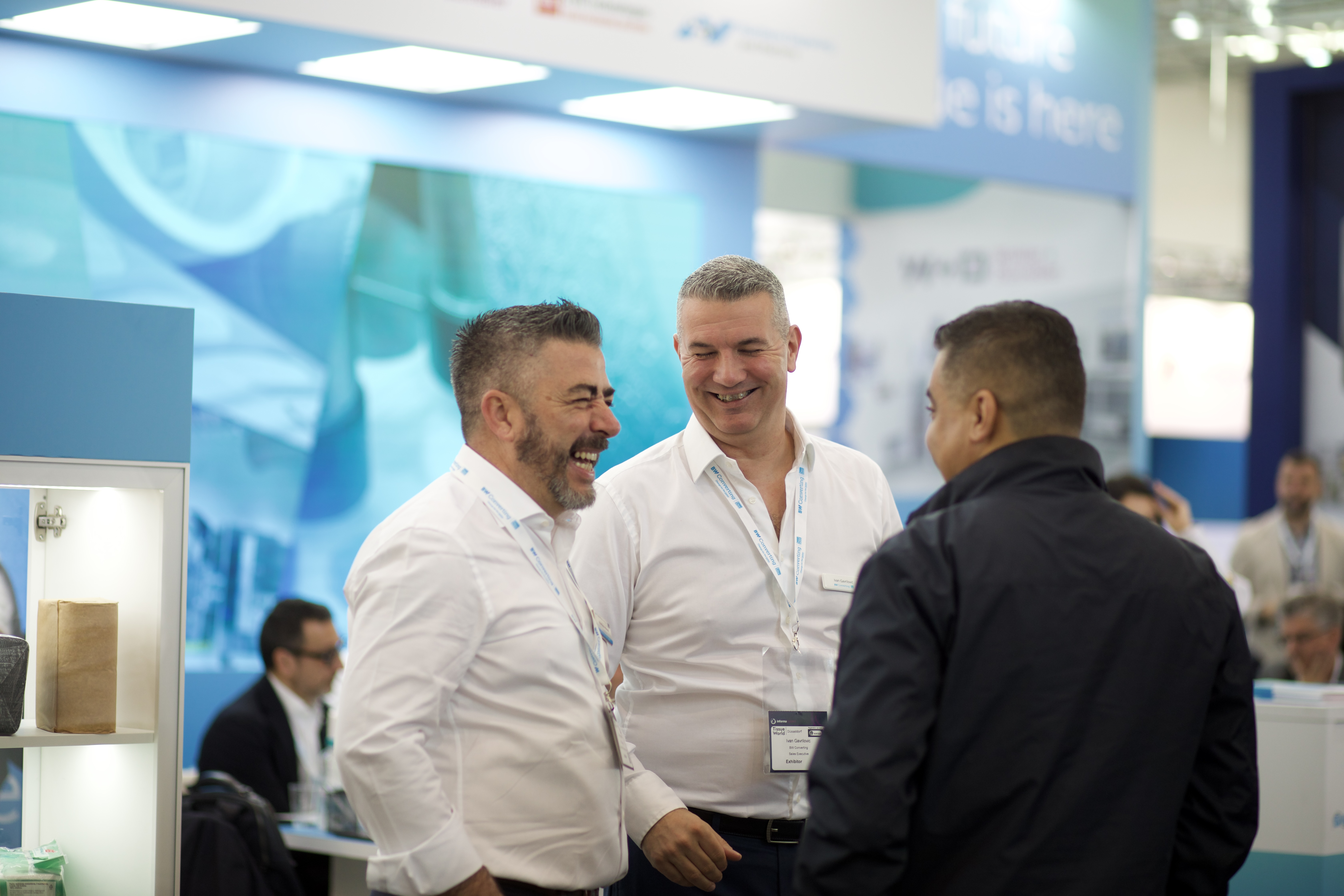 Exhibitor chatting to visitors
