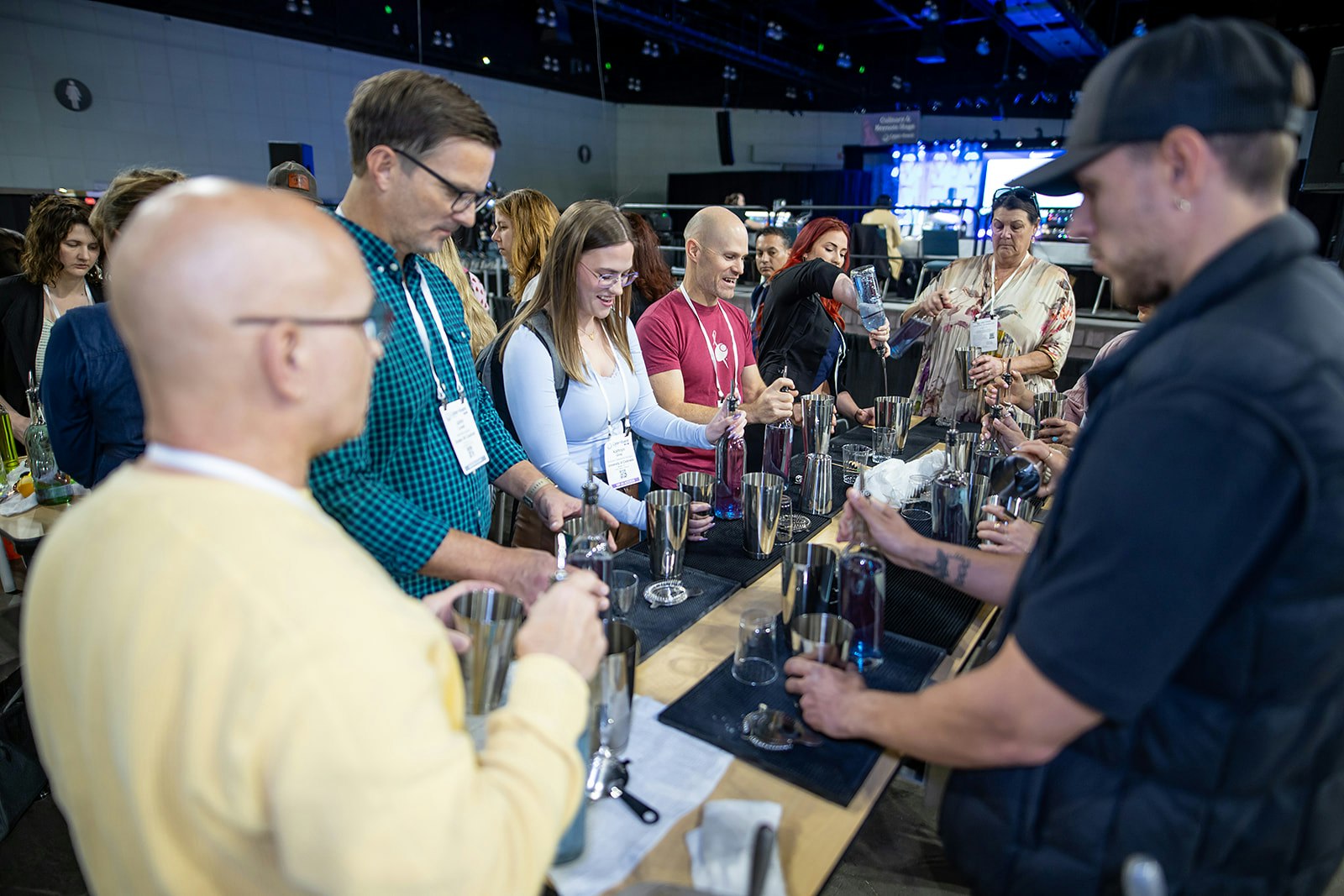 A group of people participating in drinks preparations