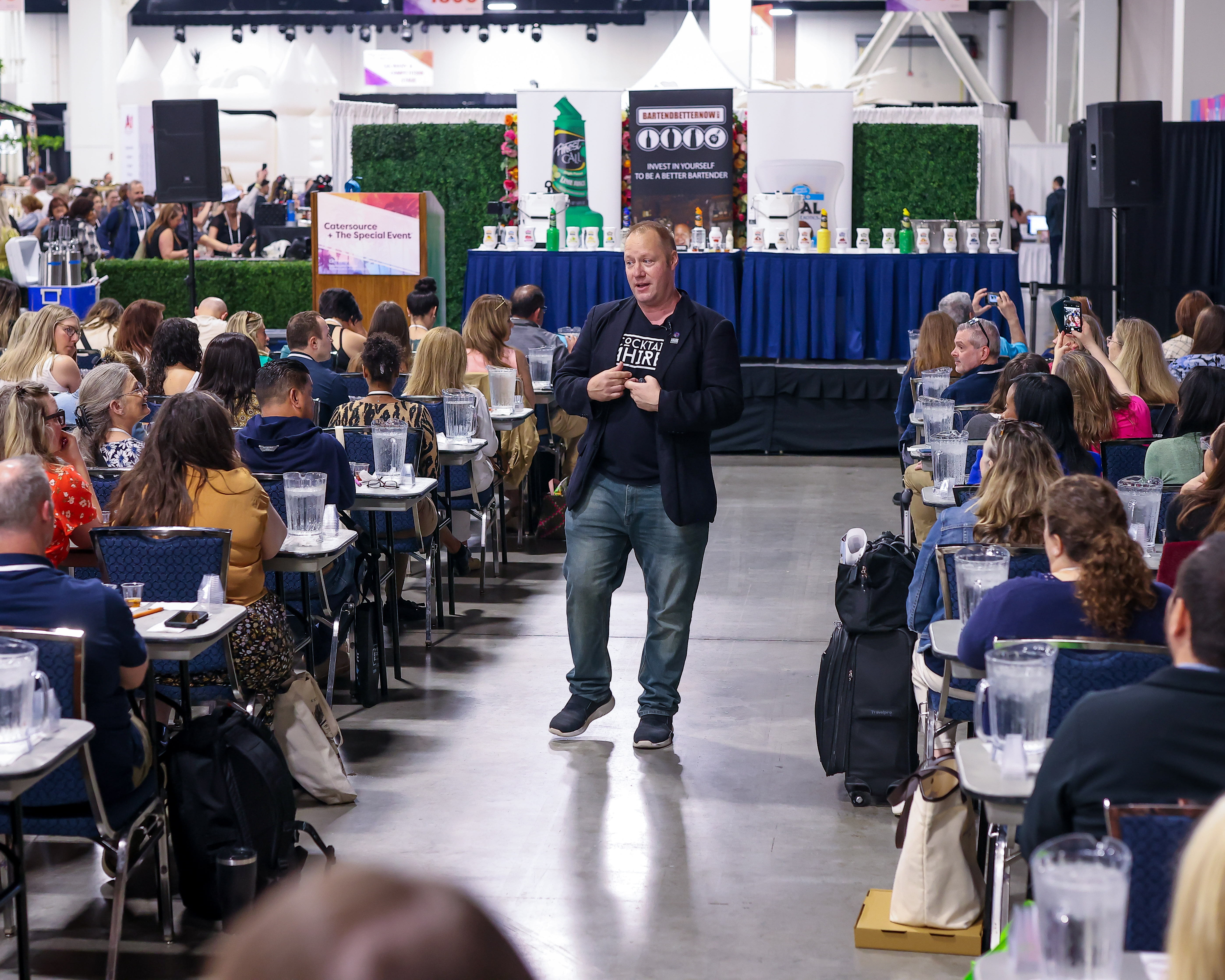A speaker holding a microphone