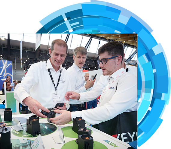 An exhibitor explaining his product to an attendee