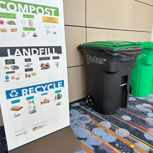 Attendees at WasteExpo holding reusable cups