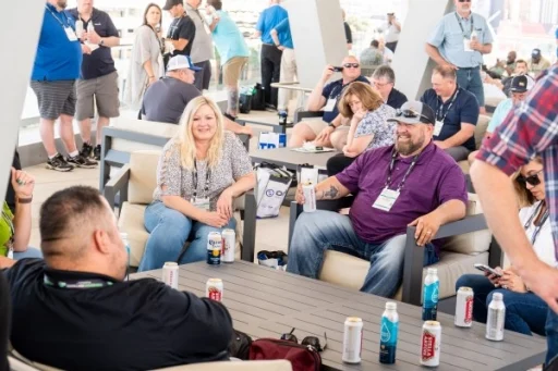 Group chatting while sitting on couches at the Public Sector Reception