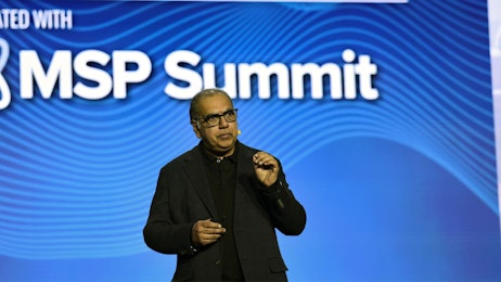 A man speaking onstage