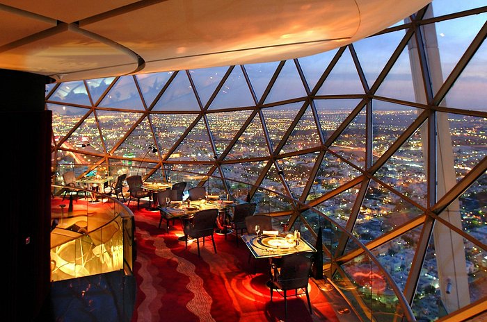 Restaurant with panoramic city views at twilight from a high vantage point