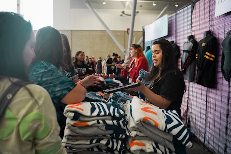 fans shopping at the HerUniverse booth