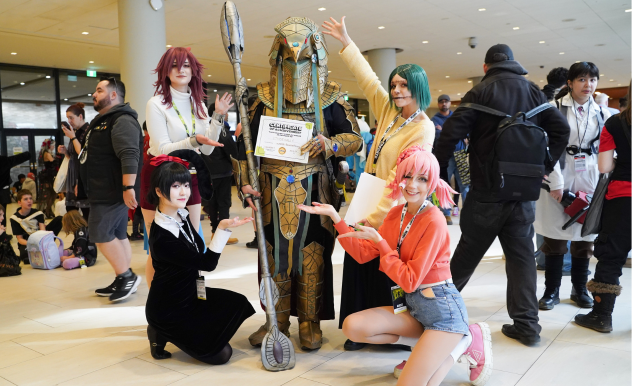 The four cosplayers of Snacck Box pose with the first ever Cosplay Hallway Award winner