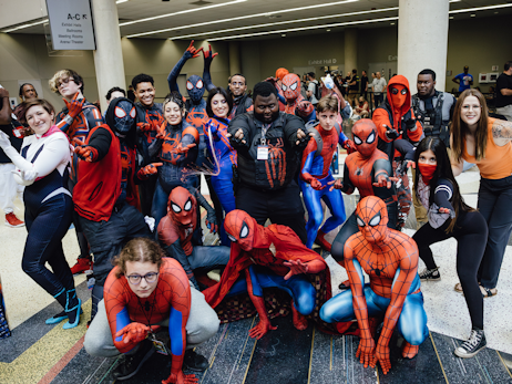 A group of Spider-Man cosplayers posing for a big group photo.