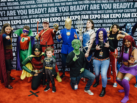 Group of cosplayers dressed as different characters from the DC Universe
