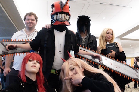 a group of cosplayers all dressed as characters from Chainsaw Man and Death Note