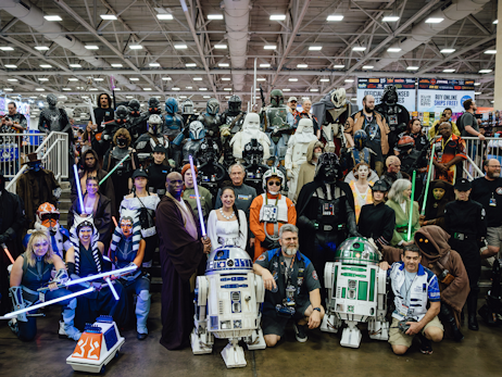 a large group of star wars cosplayers posing for a big group photo.
