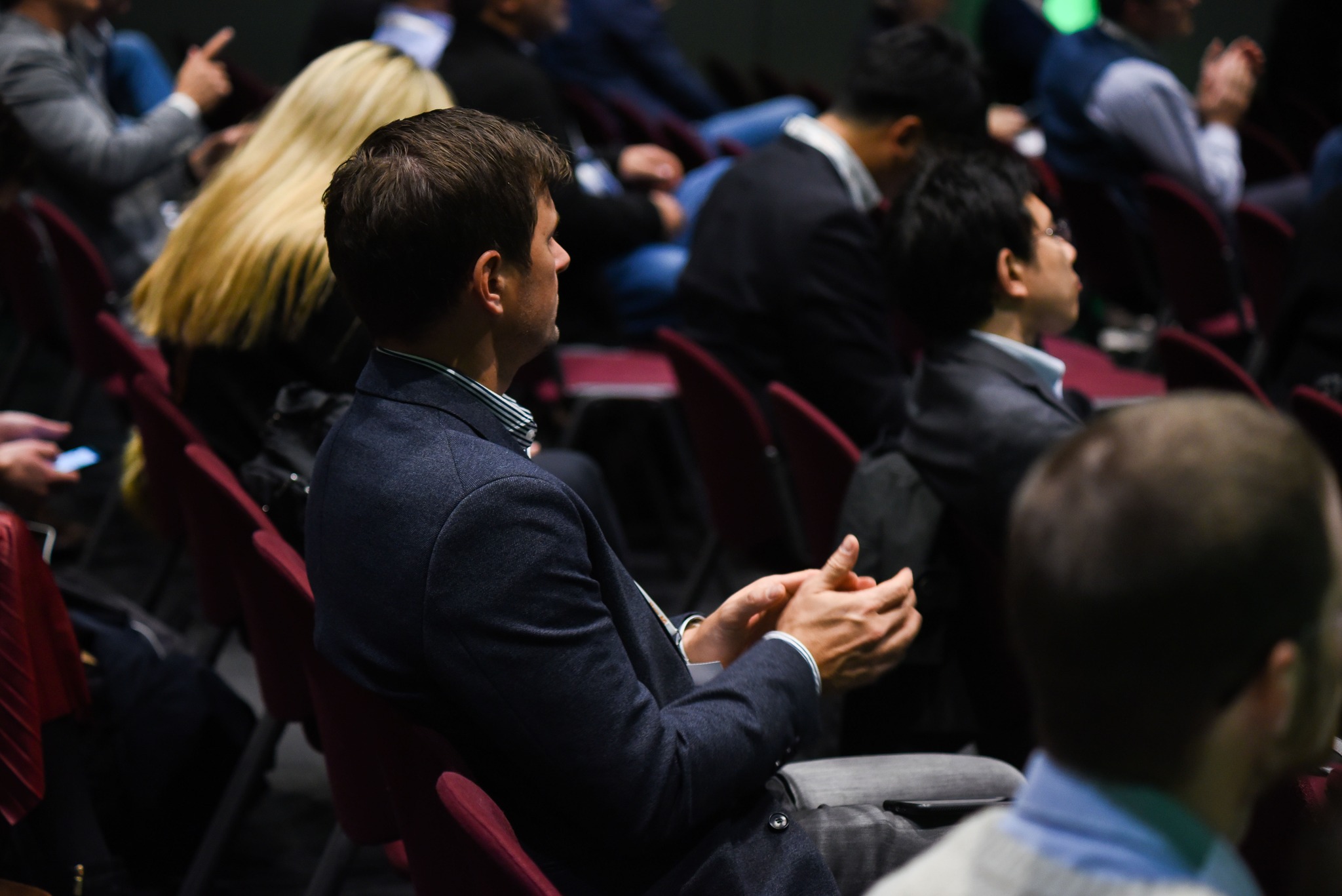 Young man clapping after a presentation