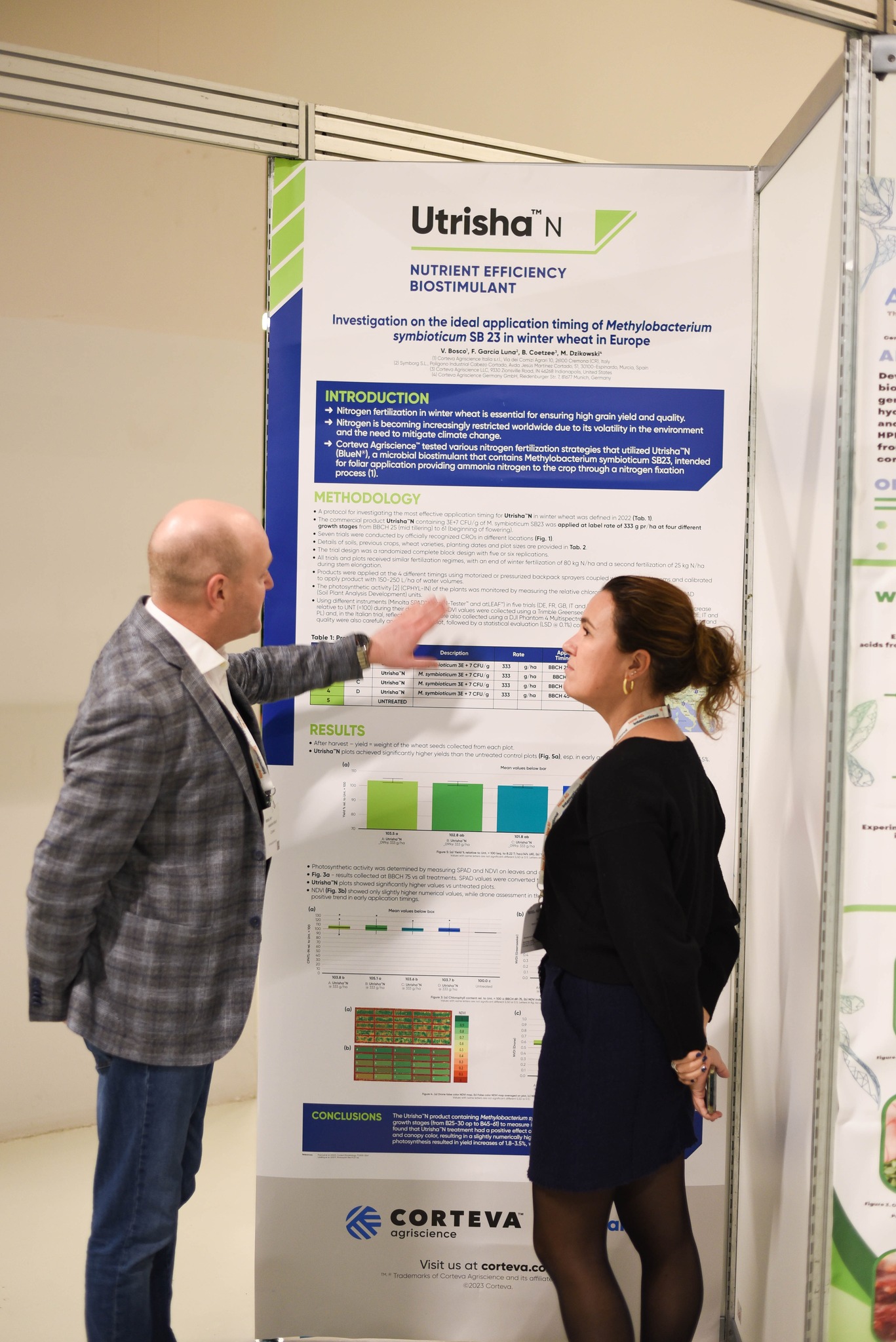 Two people discussing the content of a panel presentation during the panel tour in 2023