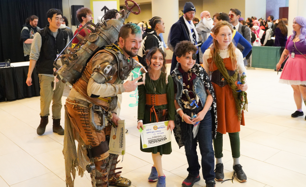 Unorhodox Design poses with three friends, one of whom won a cosplay hallway award for her Fae cosplay