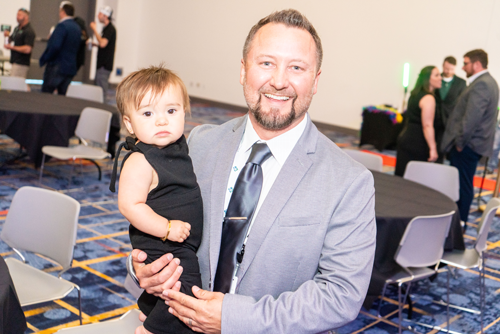 WasteExpo Attendee Holding Baby During Award